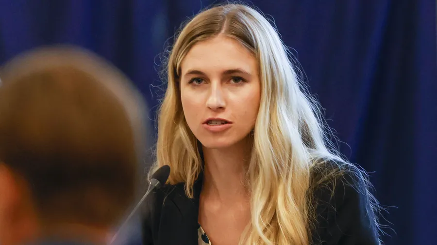 Student Body President Lauren Lemasters directs a question to Sen. Ben Sasse during a University of Florida board of trustees meeting