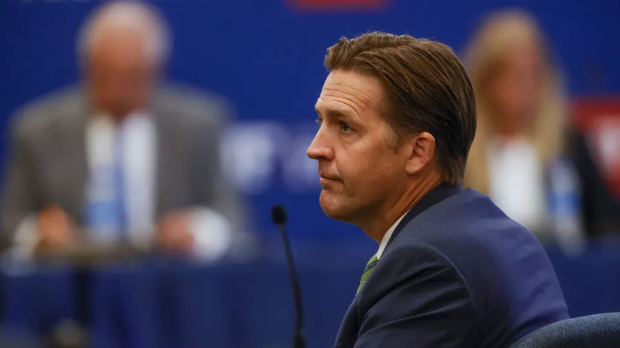 Sen. Ben Sasse listens to public comments during a University of Florida board of trustees meeting.