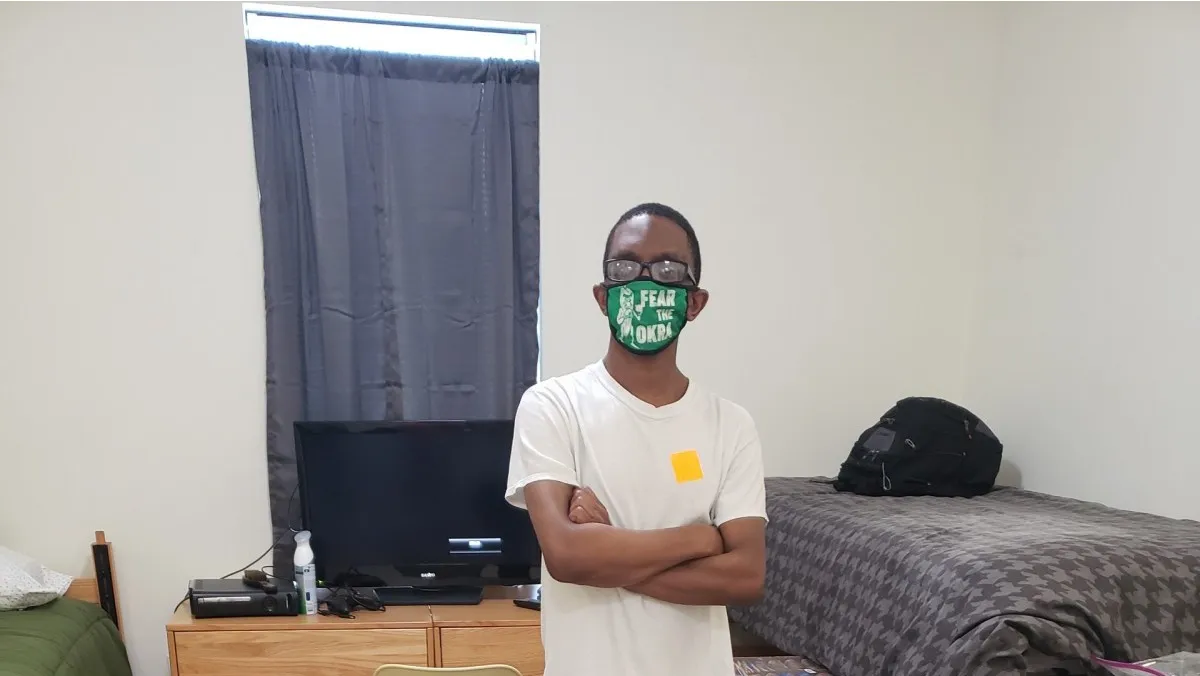 Avery Williams in a green mask