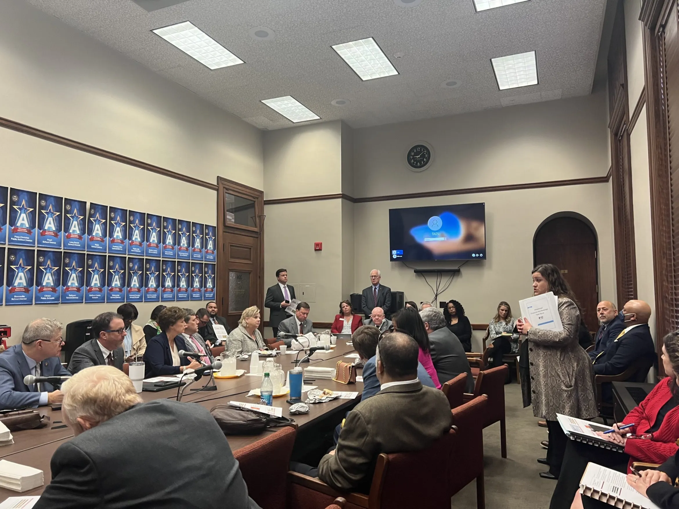 Jennifer Rogers, standing right, presented the new state financial aid redesign proposal