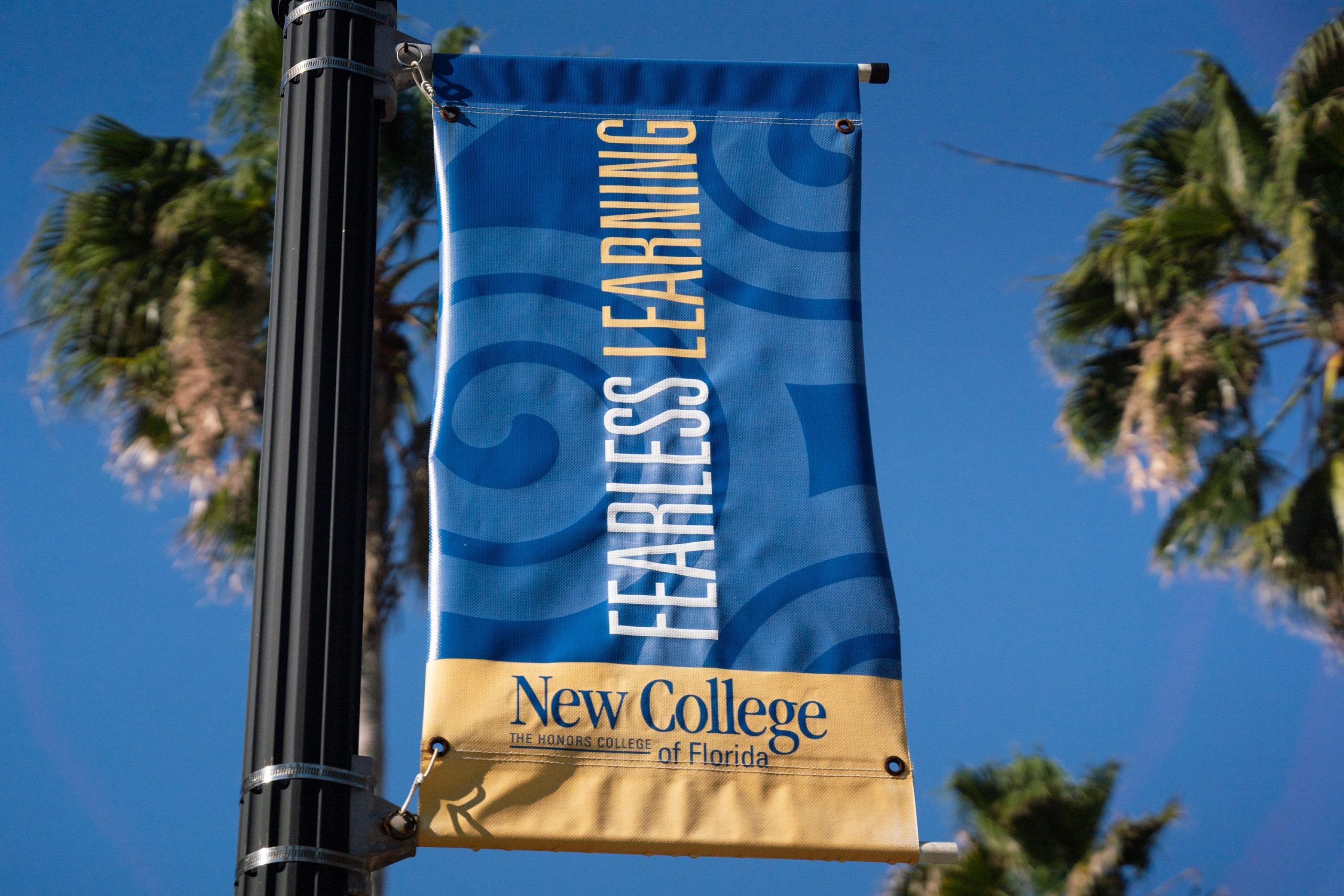 A blue New College banner