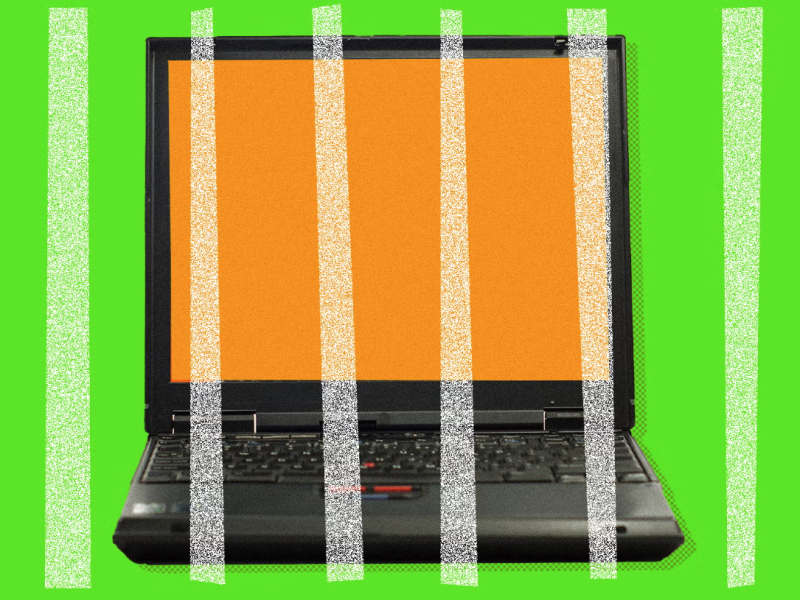 Picture of a black laptop with an orange screen and green background.