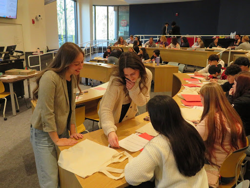 Two Chico State students lead an interactive activity at a conference with high school students