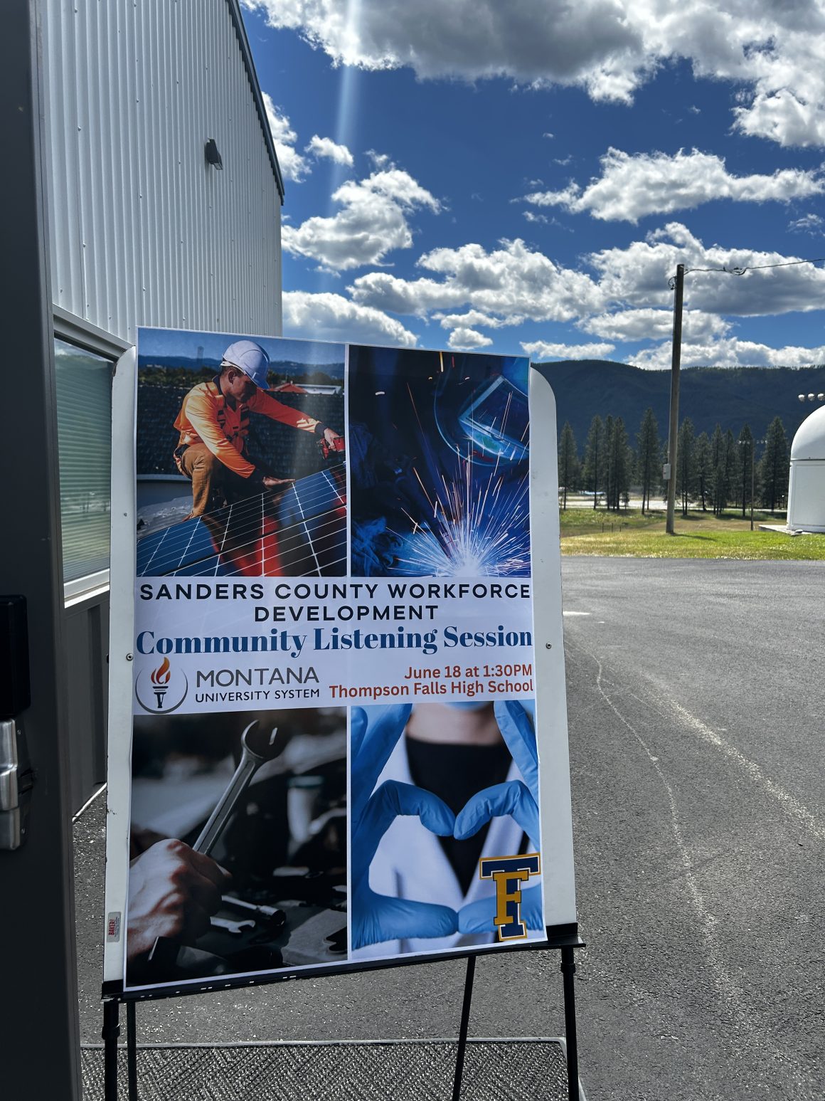 A sign introducing the Community Listening Session in Thompson Falls features bright images of people practicing different trades